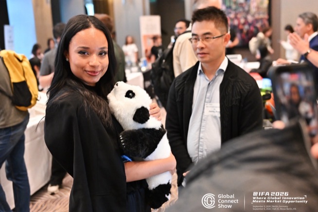 An attendee with a panda plush at a brand demo, GCS @IFA 2026